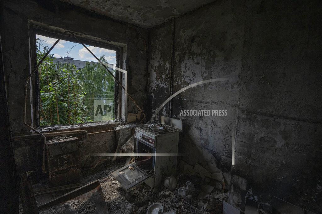Nariman El-Mofty Damage in the kitchen of 64-year-old Tetiana Solohub, destroyed from Russian aerial bombs, in Borodyanka, Kyiv region, Ukraine, Tuesday, June 28, 2022. "And now, at 64, I am forced to be homeless," Solohub said. She doesn't have a damaged apartment to live in. Hers is completely gone. Solohub now lives in a camp made of shipping containers. (AP Photo/Nariman El-Mofty)