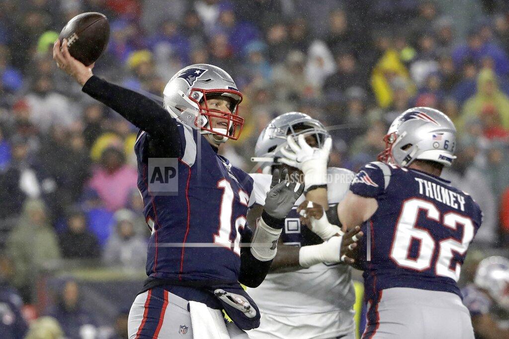 Steven Senne New England Patriots quarterback Tom Brady passes behind a block by guard Joe Thuney in the first half of an NFL football game against the Dallas Cowboys, Sunday, Nov. 24, 2019, in Foxborough, Mass. (AP Photo/Steven Senne)