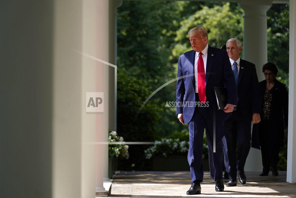 President Donald Trump arrives to speak at a news conference in the Rose Garden of the White House, Friday, June 5, 2020, in Washington. Vice President Mike Pence and Small Business Administration administrator Jovita Carranza are at right. (AP Photo/Evan Vucci)