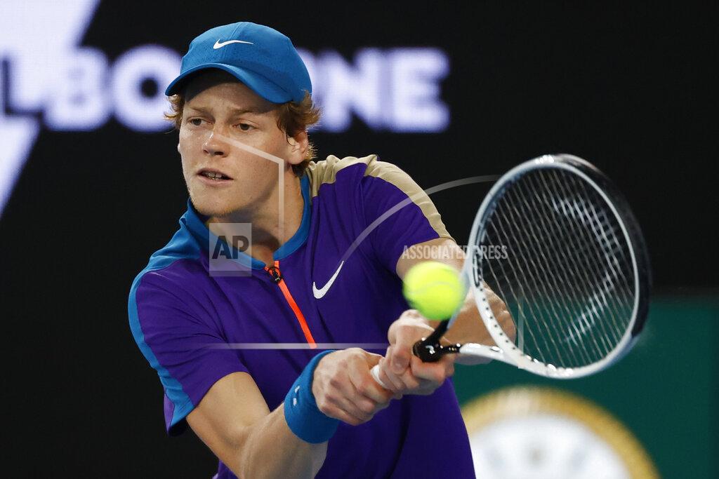 Rick Rycroft Italy's Jannik Sinner makes a backhand return to Canada's Denis Shapovalov during the first round match at the Australian Open tennis championship in Melbourne, Australia, Monday, Feb. 8, 2021.(AP Photo/Rick Rycroft)