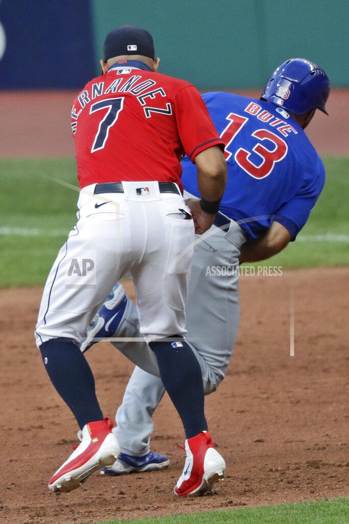 Tony Dejak Chicago Cubs' David Bote (13) is tagged out by Cleveland Indians' Cesar Hernandez (7) in the fifth inning in a baseball game, Wednesday, Aug. 12, 2020, in Cleveland. (AP Photo/Tony Dejak)