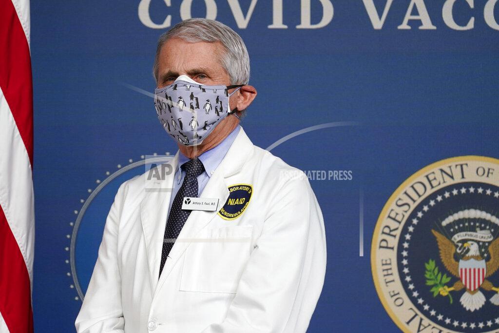 Evan Vucci FILE - In this Feb. 25, 2021, Dr. Anthony Fauci, director of the National Institute of Allergy and Infectious Diseases, listens as President Joe Biden speaks during an event to commemorate the 50 millionth COVID-19 shot in Washington. Fauci said Sunday, March 14, he wishes former President Donald Trump would use his popularity among Republicans to persuade his followers to get the COVID-19 vaccine. In a round of interviews on the morning news shows, Fauci lamented polling showing that Trump supporters are more likely to refuse to get vaccinated, saying politics needs to be separated from “commonsense, no-brainer” public health measures. (AP Photo/Evan Vucci, File)
