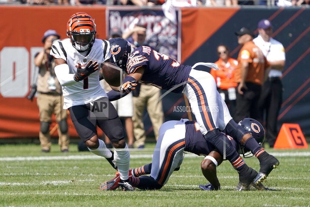 David Banks Cincinnati Bengals wide receiver Ja'Marr Chase, left, is unable to catch quarterback Joe Burrow's pass as Chicago Bears defensive back DeAndre Houston-Carson (36) and Kindle Vildor (22) defend during the first half of an NFL football game Sunday, Sept. 19, 2021, in Chicago. (AP Photo/David Banks)