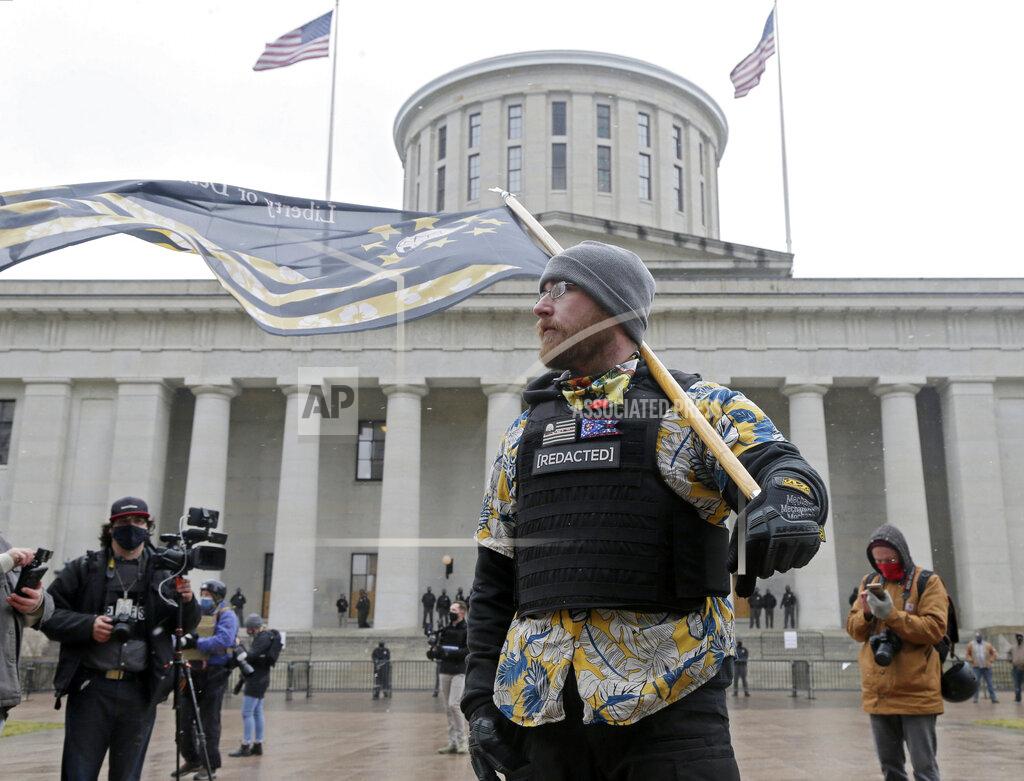 Barbara J. Perenic Members of the Boogaloo Boys attend protest Sunday at the Ohio Statehouse in downtown Columbus, Ohio, Sunday, Jan. 17, 2021. (Barbara J. Perenic/The Columbus Dispatch via AP)