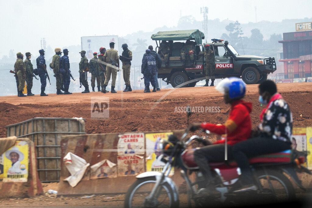 Jerome Delay Security forces gather in Kampala, Uganda, Thursday, Jan. 14, 2021. Ugandans are voting in a presidential election tainted by widespread violence that some fear could escalate as security forces try to stop supporters of leading opposition challenger BobiWine from monitoring polling stations.(AP Photo/Jerome Delay)