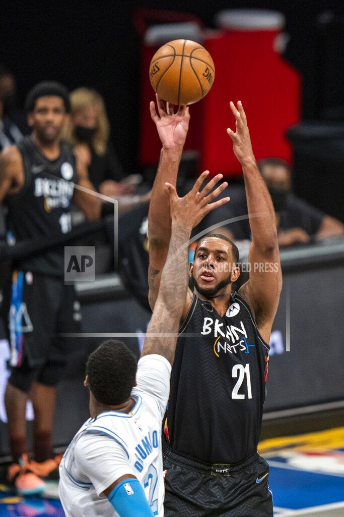 Corey Sipkin Brooklyn Nets center LaMarcus Aldridge (21) shoots over Los Angeles Lakers center Andre Drummond (2) during the first half of an NBA basketball game Saturday, April 10, 2021, in New York. (AP Photo/Corey Sipkin)