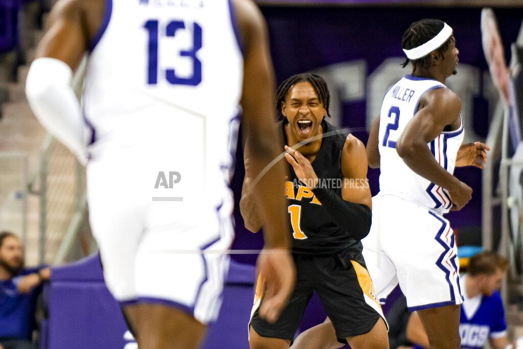 Emil Lippe Arkansas-Pine Bluff Golden Lions guard Kylen Milton (1) smiles after his team hit a 3-point basket in the first half of an NCAA college basketball game against TCU in Fort Worth, Texas, Monday, Nov. 7, 2022. (AP Photo/Emil Lippe)
