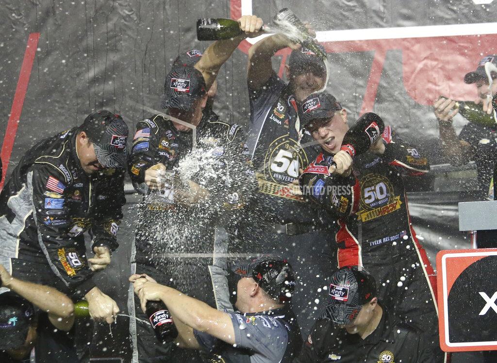 David Graham Tyler Reddick, right, celebrates in Victory Lane after winning the NASCAR Xfinity Series auto racing championship on Saturday, Nov. 16, 2019, at Homestead-Miami Speedway in Homestead, Fla. (AP Photo/David Graham)