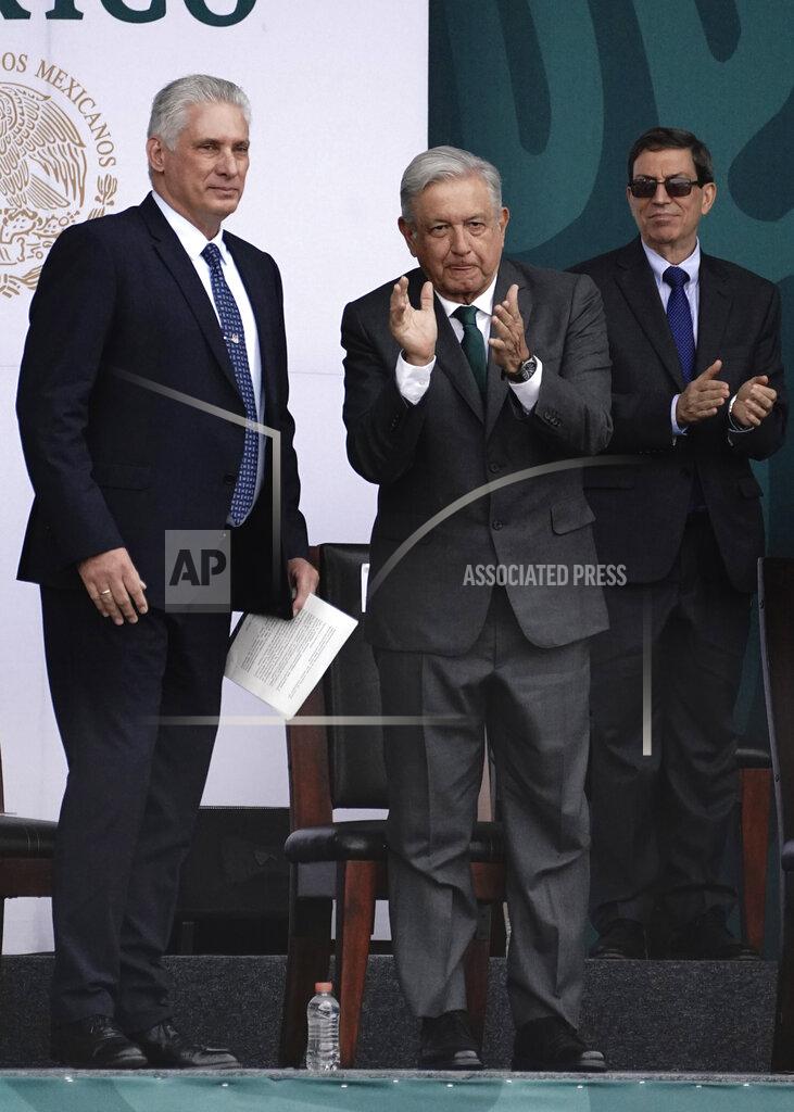 Marco Ugarte Cuba's President Miguel Diaz-Canel, left, accompanies Mexico's President Andres Manuel Lopez Obrador, during Independence Day celebrations, in the Zocalo in Mexico City, Thursday, Sept. 16, 2021. (AP Photo/Marco Ugarte)