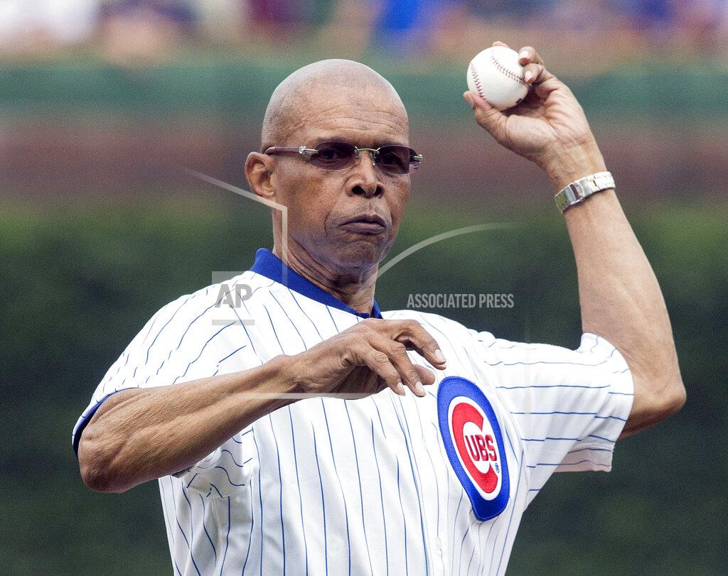 Andrew Nelles FILE - In this July 11, 2014, file photo, former Chicago Bears NFL football player Gale Sayers throws out a ceremonial first pitch before a baseball game between the Chicago Cubs and Atlanta Braves, in Chicago. Hall of Famer Gale Sayers, who made his mark as one of the NFL’s best all-purpose running backs and was later celebrated for his enduring friendship with Chicago Bears teammate Brian Piccolo, has died. He was 77. Nicknamed “The Kansas Comet” and considered among the best open-field runners the game has ever seen, Sayers died Wednesday, Sept. 23, 2020, according to the Pro Football Hall of Fame. (AP Photo/Andrew A. Nelles, FIle)