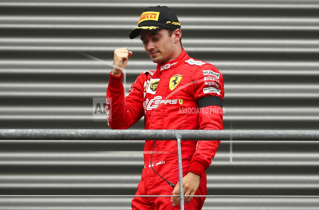 Francisco Seco Ferrari driver Charles Leclerc of Monaco pumps his fist as he walks to the podium after finishing first in the Belgian Formula One Grand Prix in Spa-Francorchamps, Belgium, Sunday, Sept. 1, 2019. Mercedes driver Lewis Hamilton of Britain placed second and Mercedes driver Valtteri Bottas of Finland placed third. (AP Photo/Francisco Seco)
