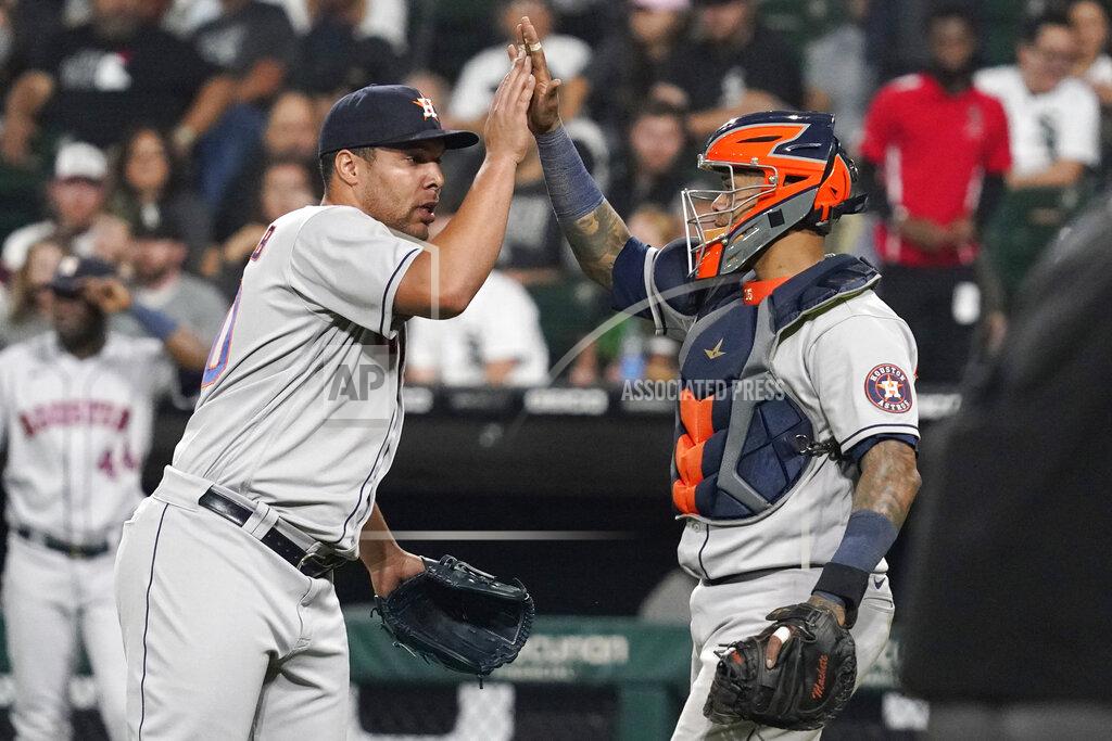 Nam Y. Huh Houston Astros relief pitcher Andre Scrubb, left, celebrates with catcher Martin Maldonado after the Astros defeated the Chicago White Sox 7-1 in a baseball game in Chicago, Friday, July 16, 2021. (AP Photo/Nam Y. Huh)