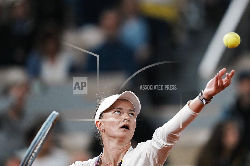 Thibault Camus Barbora Krejcikova of the Czech Republic serves against France's Diane Parry during their first round match at the French Open tennis tournament in Roland Garros stadium in Paris, France, Monday, May 23, 2022. (AP Photo/Thibault Camus)
