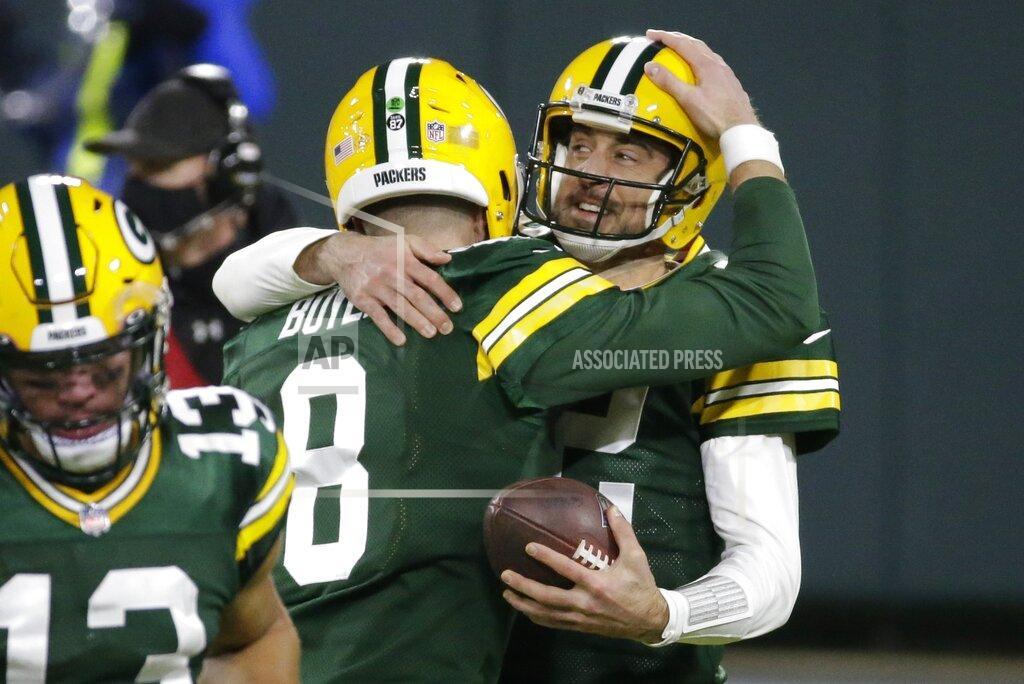 Mike Roemer Green Bay Packers' Aaron Rodgers celebrates a touchdown pass with Tim Boyle (8) during the second half of an NFL football game against the Philadelphia Eagles Sunday, Dec. 6, 2020, in Green Bay, Wis. (AP Photo/Mike Roemer)