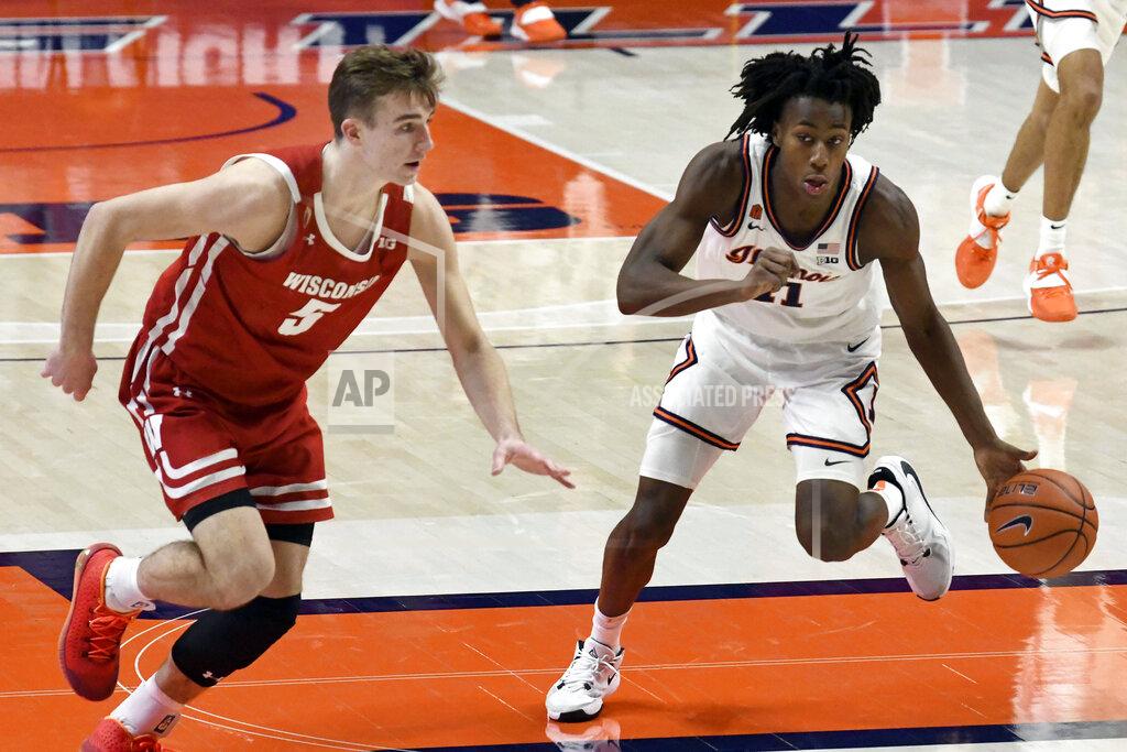 Holly Hart Illinois guard Ayo Dosunmu (11) drives the ball past Wisconsin's forward Tyler Wahl (5) in the second half of an NCAA college basketball game Saturday, Feb. 6, 2021, in Champaign, Ill. (AP Photo/Holly Hart)