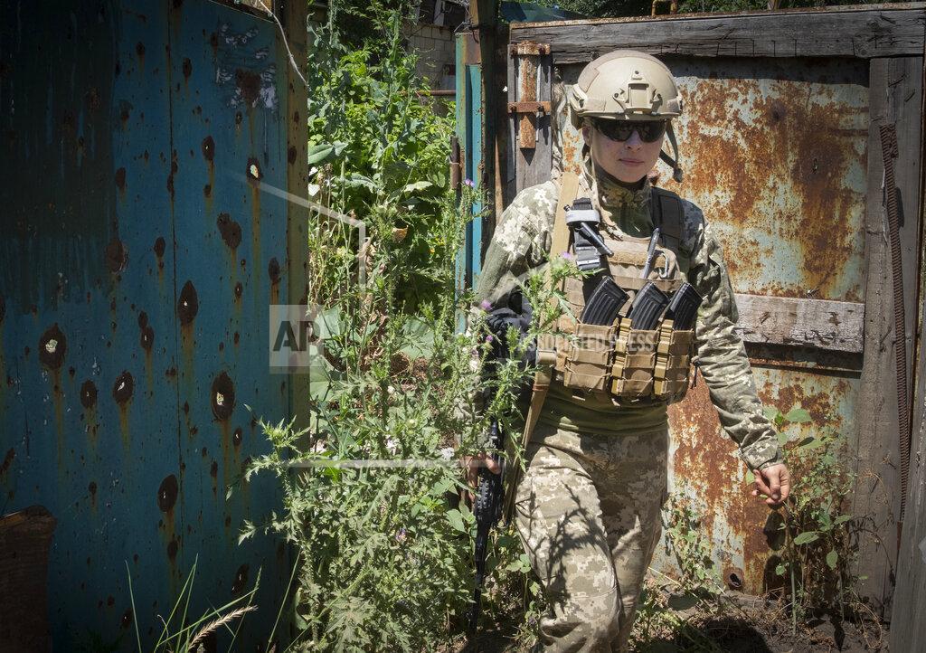 Efrem Lukatsky Ukrainian platoon commander Mariia walks in a position in the Donetsk region, Ukraine, Saturday, July 2, 2022. Ukrainian soldiers returning from the frontlines in eastern Ukraine’s Donbas region describe life during what has turned into a grueling war of attrition as apocalyptic. Mariia, 41, said that front-line conditions may vary depending on where a unit is positioned and how well supplied they are. (AP Photo/Efrem Lukatsky)