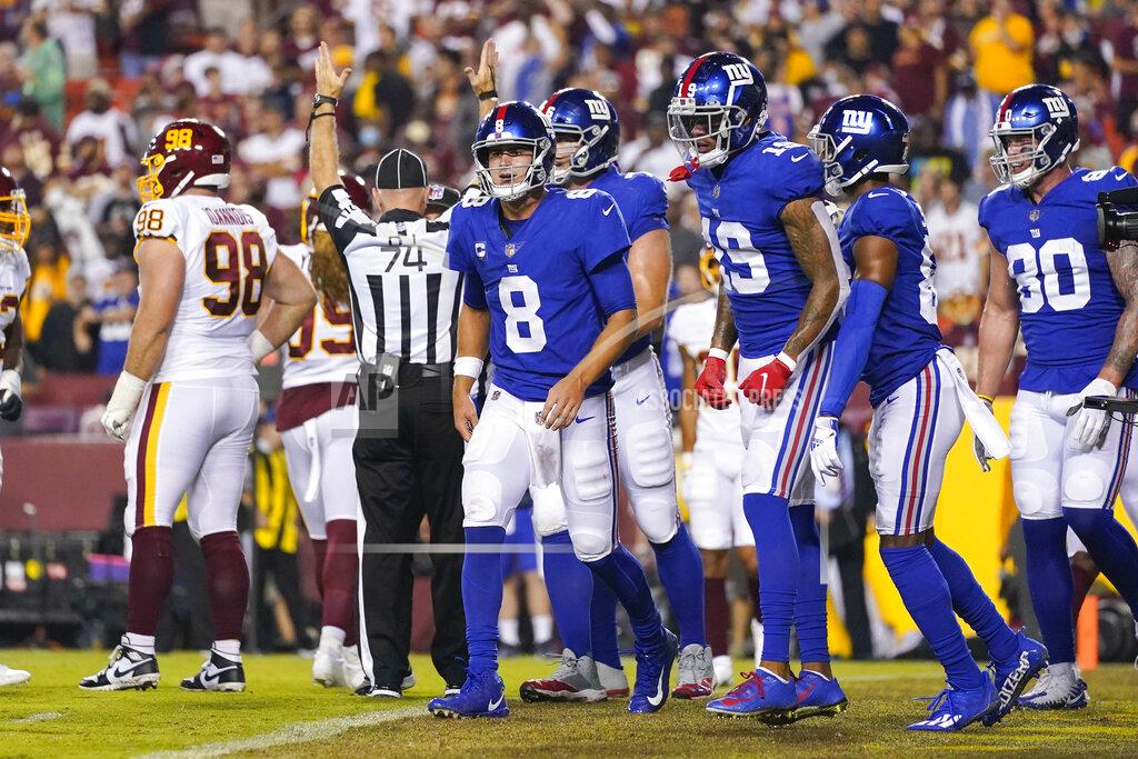 Alex Brandon New York Giants quarterback Daniel Jones (8) walks back to the sidelines after running the ball in to score a touchdown against the Washington Football Team during the first half of an NFL football game, Thursday, Sept. 16, 2021, in Landover, Md. (AP Photo/Alex Brandon)