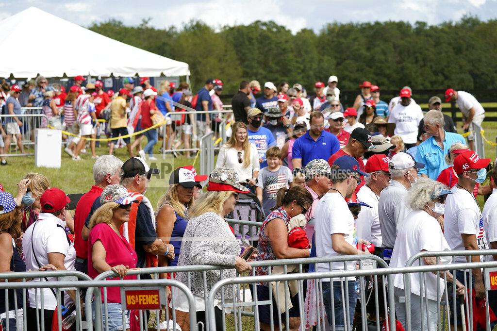 John Raoux Supporters enter a campaign rally for President Donald Trump Friday, Oct. 23, 2020, in The Villages, Fla. (AP Photo/John Raoux)