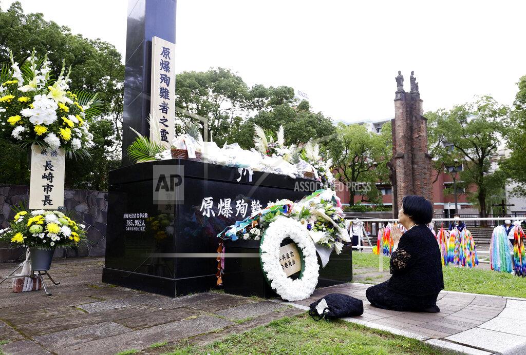 085123+0900 A bereaved family member prays for the victims of U.S. atomic bombing at the Atomic Bomb Hypocenter Park in Nagasaki, southern Japan, Sunday, Aug. 9, 2020. Nagasaki marked the 75th anniversary of the atomic bombing on Sunday. (Kyodo News via AP)