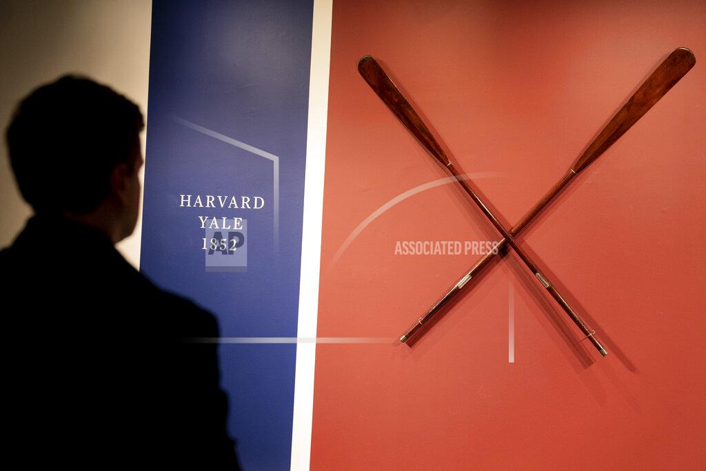 John Minchillo The Harvard-Yale Regatta 1852 Trophy Oars are displayed before an auction, Thursday, April 21, 2022, at Sotheby's in the Manhattan borough of New York. Sotheby's estimates the oars value between three and five million dollars. The oars were awarded to Harvard's winning crew and represent one of the oldest collegiate athletic competitions in the nation's history. (AP Photo/John Minchillo)