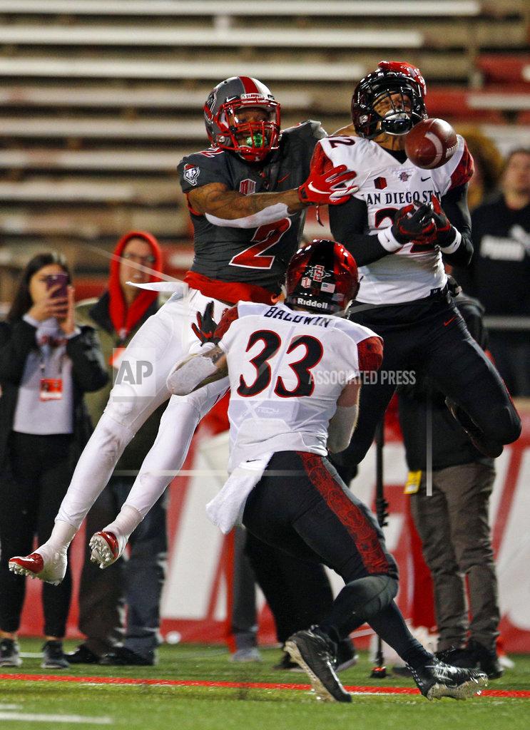 Andres Leighton San Diego State safety Tayler Hawkins (32) breaks a pass intended for New Mexico wide receiver Delane Hart-Johnson (2) as San Diego State safety Parker Baldwin (33) looks on during the second half of an NCAA college football game in Albuquerque, N.M., Saturday, Nov. 3, 2018. San Diego State won 31-23. (AP Photo/Andres Leighton)