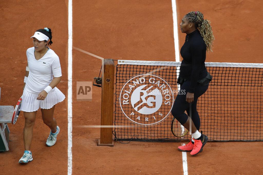 Alessandra Tarantino Serena Williams of the U.S. walks to her bench after defeating Kristie Ahn of the U.S., left, in the first round match of the French Open tennis tournament at the Roland Garros stadium in Paris, France, Monday, Sept. 28, 2020. (AP Photo/Alessandra Tarantino)