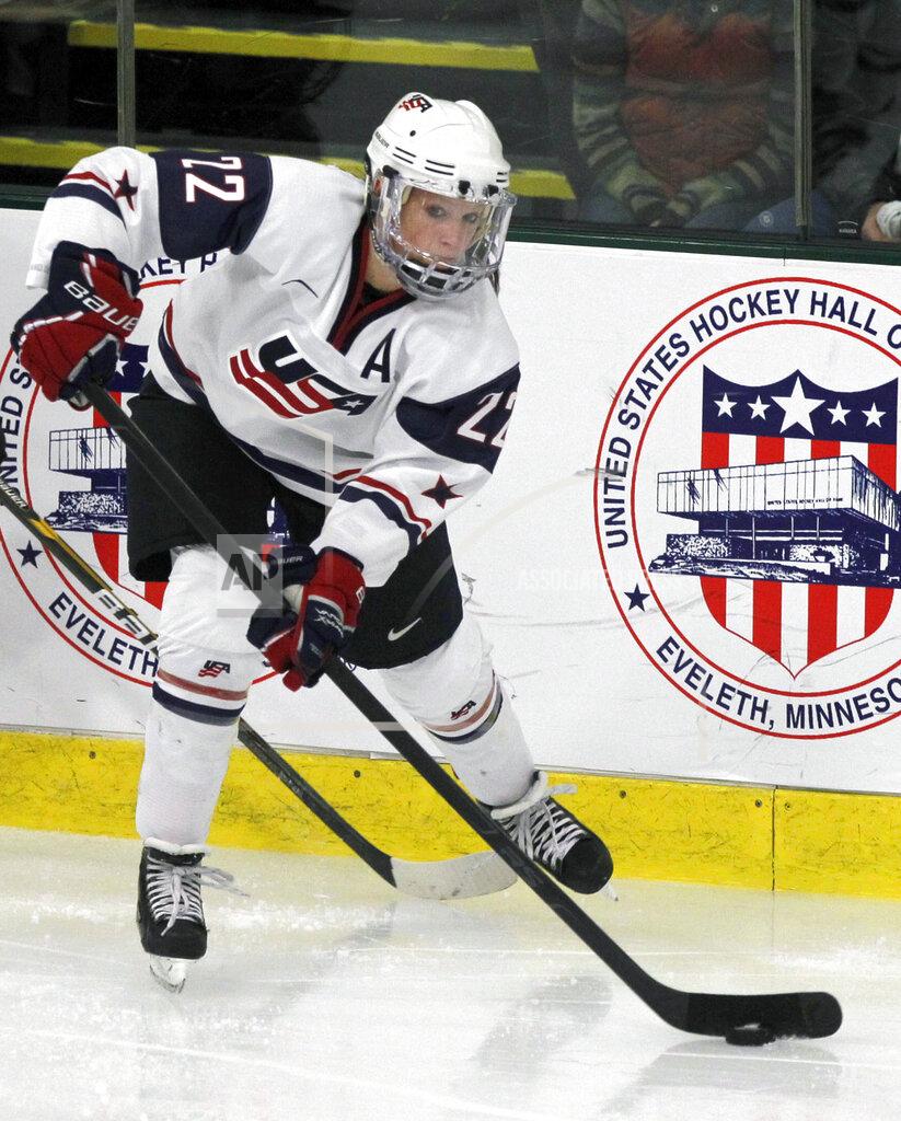 FILE - United States forward Kacey Bellamy (22) plays against Switzerland during the semifinals of the World Women's Ice Hockey Championships in Burlington, Vt., in this Friday, April 13, 2012, file photo. (AP Photo/Toby Talbot, File)