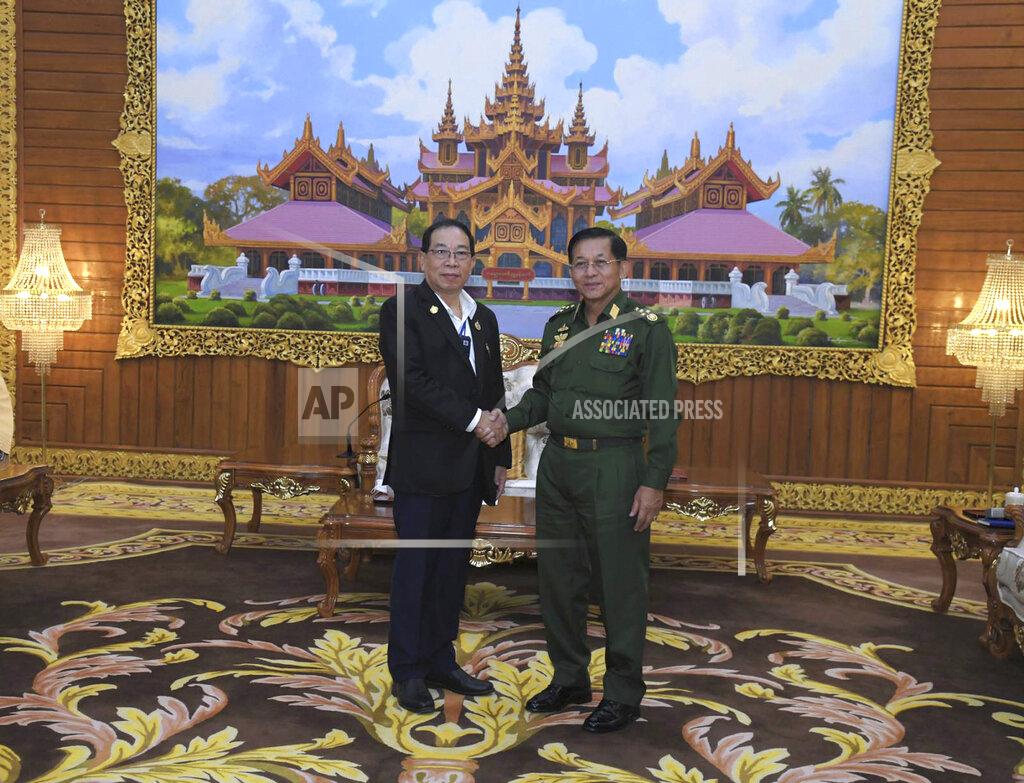 Uncredited In this photo provided by the Myanmar Military True News Information Team, Senior Gen. Min Aung Hlaing, right, head of the military council, shakes hand with Yawd Serk, chairman of Shan State Army, during their meeting Friday, May 20, 2022, in Naypyitaw, Myanmar. (Military True News Information Team via AP)