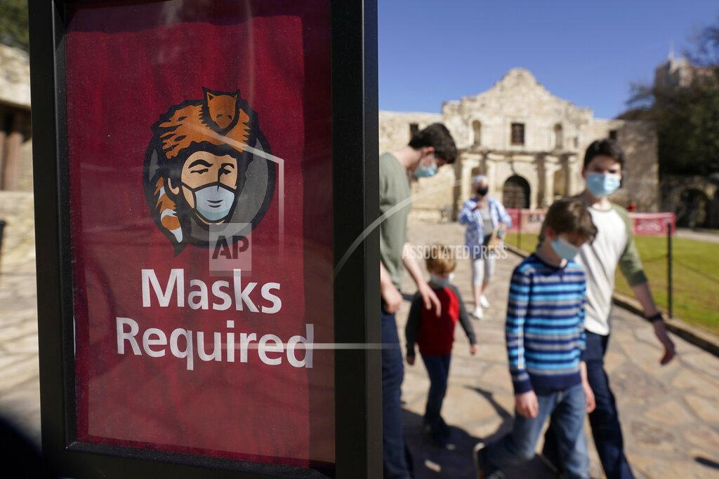 Eric Gay Visitors wearing face masks leave the Alamo, Wednesday, March 3, 2021, in San Antonio. Gov. Greg Abbott says Texas is lifting a mask mandate and lifting business capacity limits next week. (AP Photo/Eric Gay)