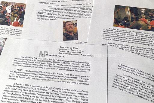 The Statement of Facts to support the complaint and arrest warrant for Christian Manley is photographed on Tuesday, Oct. 19, 2021. Court documents filed in federal court say that Manley, the Alabama man accused of using pepper spray and throwing a metal rod at law enforcement protecting the U.S. Capitol during the Jan. 6 insurrection, has been arrested in Alaska. (AP Photo/Jon Elswick)