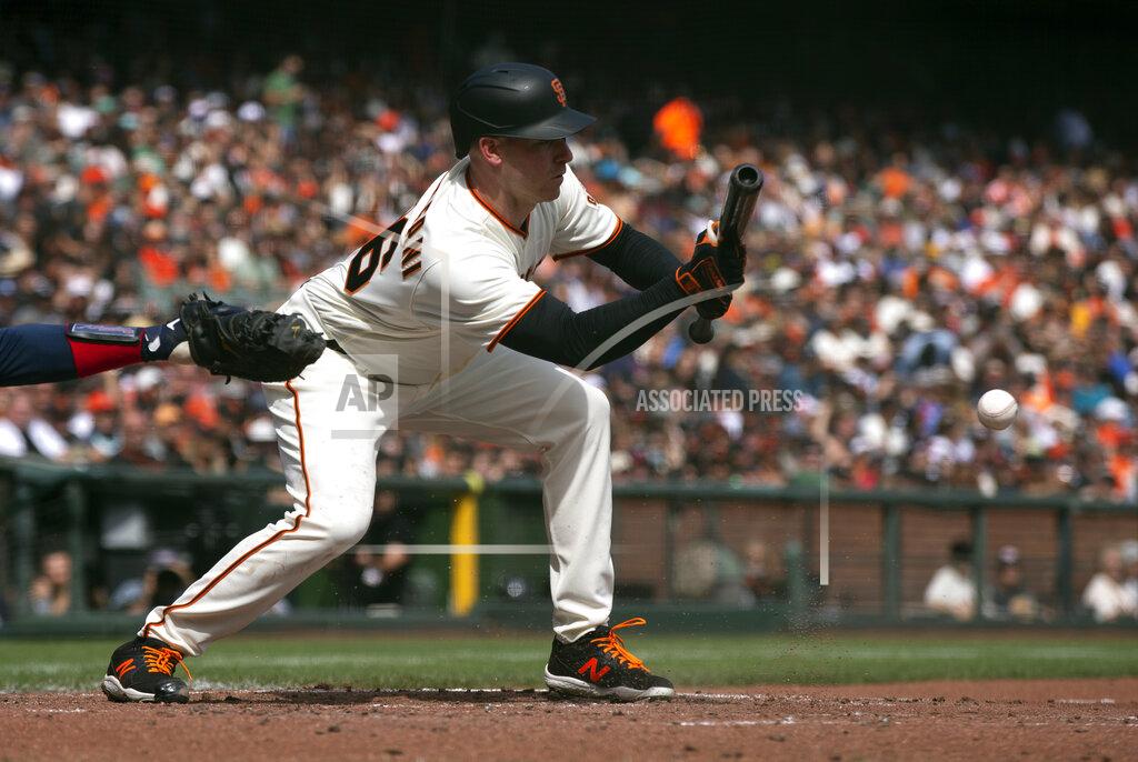 D. Ross Cameron San Francisco Giants' Anthony DeSclafani lays down a sacrifice bunt against the Atlanta Braves during the third inning of a baseball game, Sunday, Sept. 19, 2021, in San Francisco. (AP Photo/D. Ross Cameron)