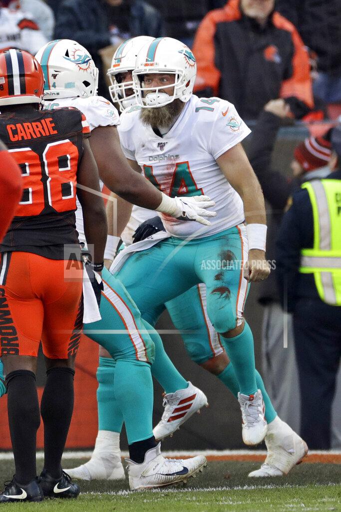 Ron Schwane Miami Dolphins quarterback Ryan Fitzpatrick (14) celebrates an 8-yard touchdown during the second half of an NFL football game against the Cleveland Browns, Sunday, Nov. 24, 2019, in Cleveland. (AP Photo/Ron Schwane)