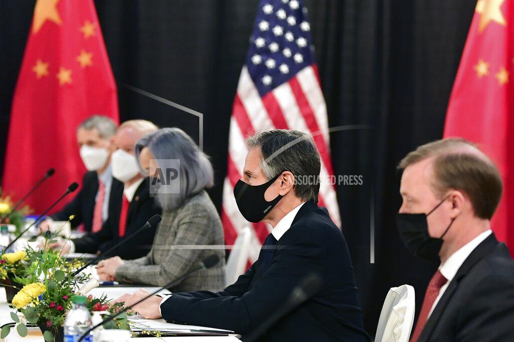Frederic J. Brown Secretary of State Antony Blinken, second from right, joined by national security adviser Jake Sullivan, right, listen as they meeti Chinese Communist Party foreign affairs chief Yang Jiechi and China's State Councilor Wang Yi at the opening session of US-China talks at the Captain Cook Hotel in Anchorage, Alaska, Thursday, March 18, 2021. (Frederic J. Brown/Pool via AP)