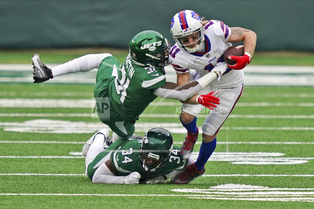 John Minchillo New York Jets defenders try to tackle Buffalo Bills' Cole Beasley, right, during the second half of an NFL football game, Sunday, Oct. 25, 2020, in East Rutherford, N.J. (AP Photo/John Minchillo)