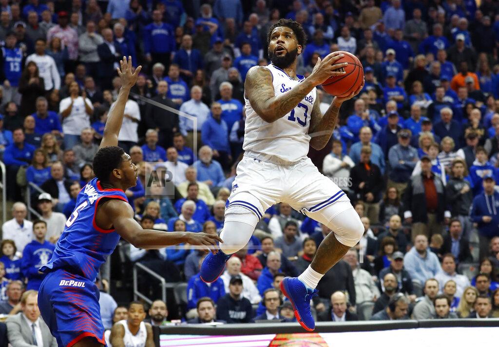 Noah K. Murray Seton Hall's Myles Powell (13) drives to the basket against DePaul's Jalen Coleman-Lands (5) during the second half of an NCAA college basketball game Wednesday, Jan. 29, 2020, in Newark, N.J. (AP Photo/Noah K. Murray)