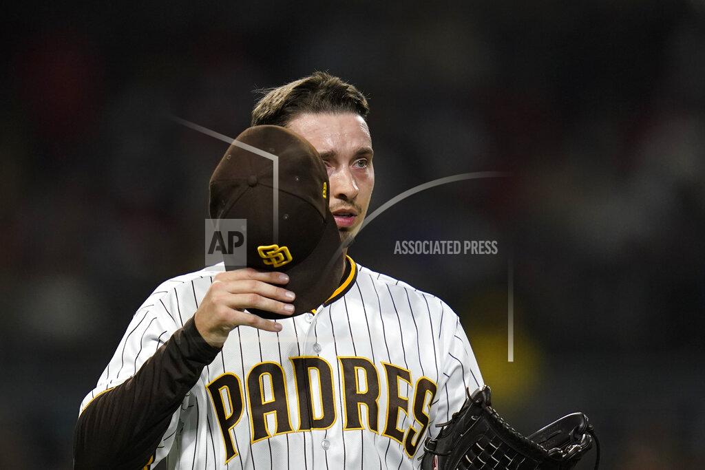 Gregory Bull San Diego Padres starting pitcher Blake Snell takes off his cap for inspection during the first inning of a baseball game against the Los Angeles Angels, Tuesday, Sept. 7, 2021, in San Diego. (AP Photo/Gregory Bull)
