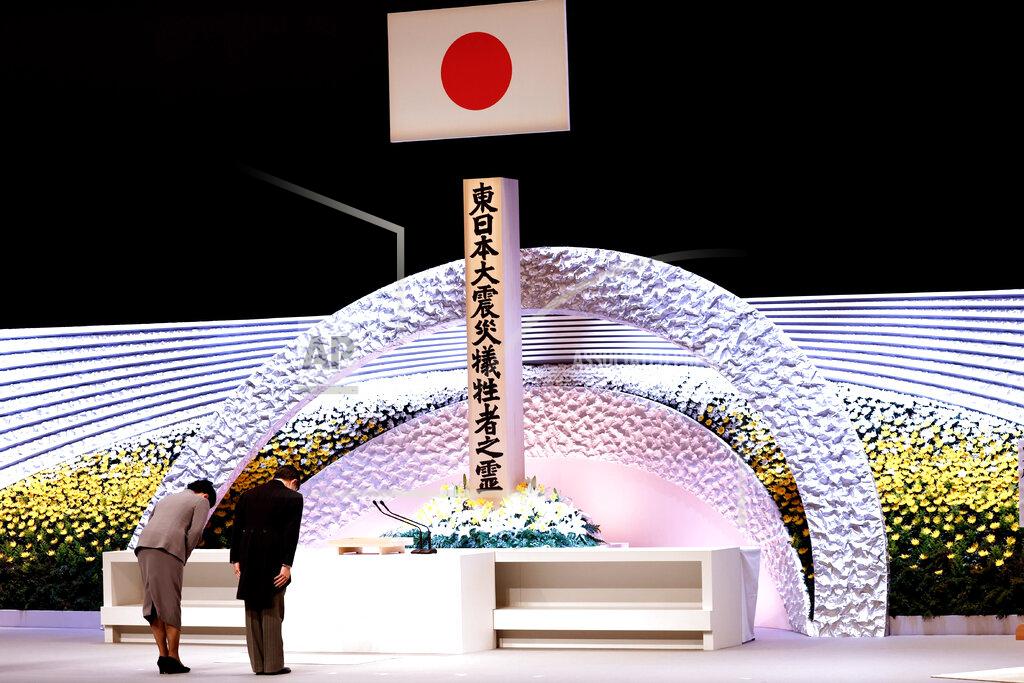 Behrouz Mehri Japan's Emperor Naruhito, right, and Empress Masako bow in front of the altar for victims of the March 11, 2011 earthquake and tsunami at the national memorial service in Tokyo, Thursday, March 11, 2021. Japan is marking the 10th anniversary of the earthquake, tsunami and nuclear disaster with many survivors’ lives are still on hold. (Behrouz Mehri/Pool Photo via AP)