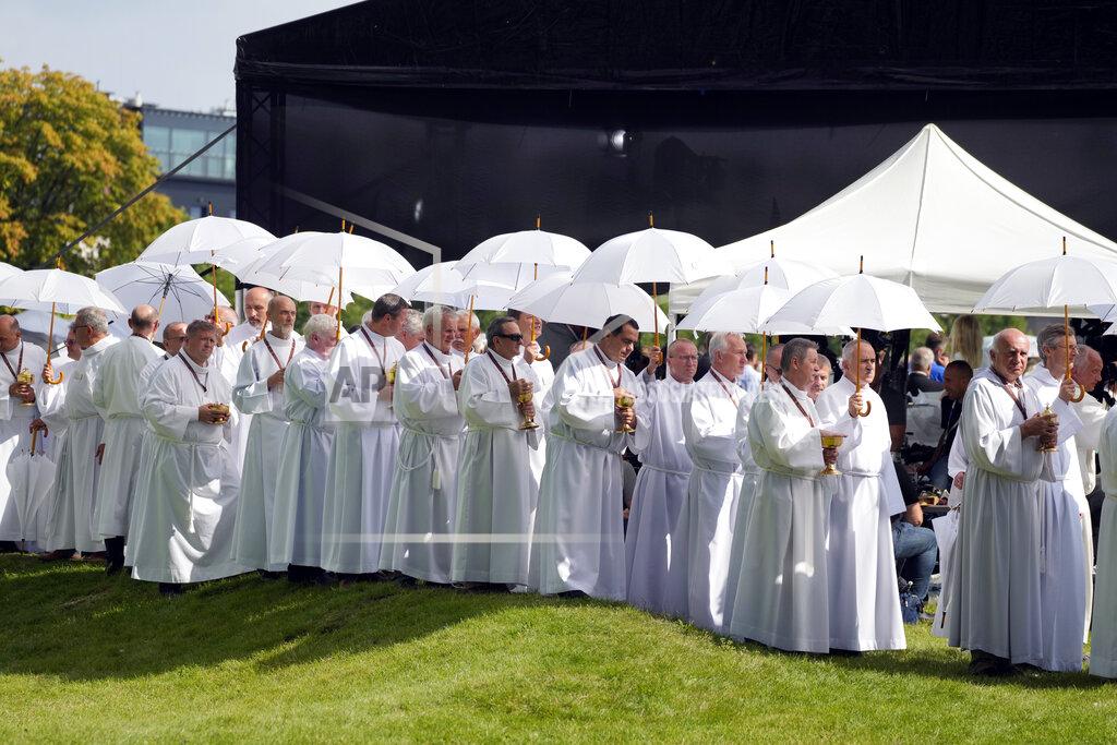 Czarek Sokolowski Catholic faithful attend the beatification ceremony of Polish Cardinal Stefan Wyszynski and Mother Elzbieta Roza Czacka in front of the church of Providence in Warsaw, Poland, Sunday, Sept. 12, 2021. Poland's top political leaders gathered in a Warsaw church Sunday for the beatification of two revered figures of the Catholic church — a cardinal who led the Polish church's resistance to communism and a blind nun who devoted her life to helping others who couldn't see. (AP Photo/Czarek Sokolowski)