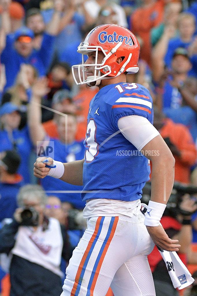 Phelan M. Ebenhack Florida quarterback Feleipe Franks (13) looks to the stands after rushing for a 3-yard touchdown during the first half of an NCAA college football game against Missouri, Saturday, Nov. 3, 2018, in Gainesville, Fla. (AP Photo/Phelan M. Ebenhack)