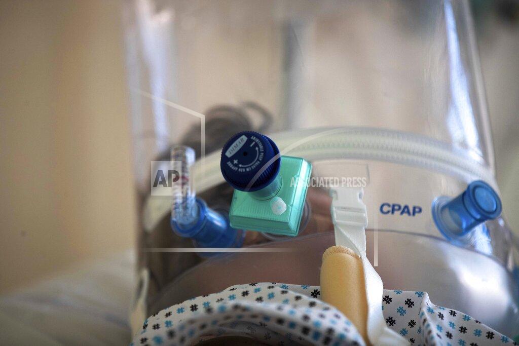 Luca Bruno FILE - In this April 8, 2020 file photo, a COVID-19 patient under treatment in the intensive care unit lies on a bed at the Circolo hospital, in Varese, Italy. Italy is poised to reclaim the dishonor of reporting the most coronavirus deaths in Europe, as the second surge ravages the country’s disproportionately old population and exposes how public health shortfalls and delayed restrictions compounded a lack of preparedness going into the pandemic. (AP Photo/Luca Bruno, file)