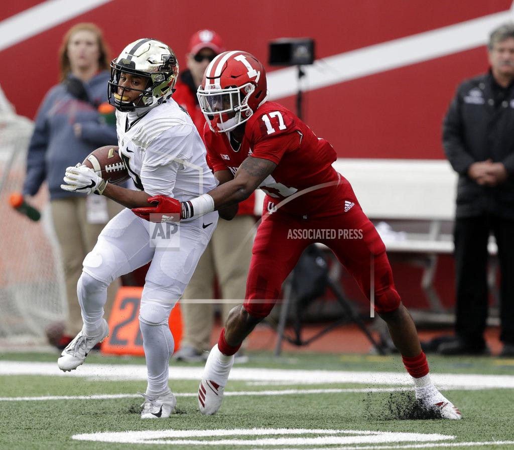 Darron Cummings Purdue's Rondale Moore (4) runs out of the tackle of Indiana's Raheem Layne for a touchdown during the first half of an NCAA college football game, Saturday, Nov. 24, 2018, in Bloomington, Ind. (AP Photo/Darron Cummings)