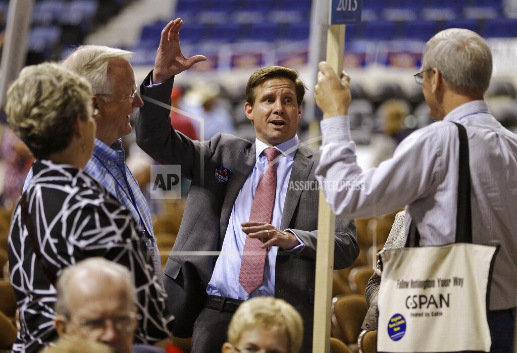 FILE - In this May 17, 2013 file photo, candidate for Lt. Governor of Virginia, Pete Snyder, center, gestures as he talks to delegates during the opening of the Virginia Republican convention in Richmond, Va. Snyder has joined the crowded field seeking the Republican nomination for Virginia governor. The CEO of a capital investment firm, Snyder said in a campaign video released Tuesday, Jan. 26, 2021 that he was running as an innovator, disruptor and problem solver seeking to shake up state politics after “eight years of failed leadership” by Democrats in the governor’s mansion. (AP Photo/Steve Helber, File)
