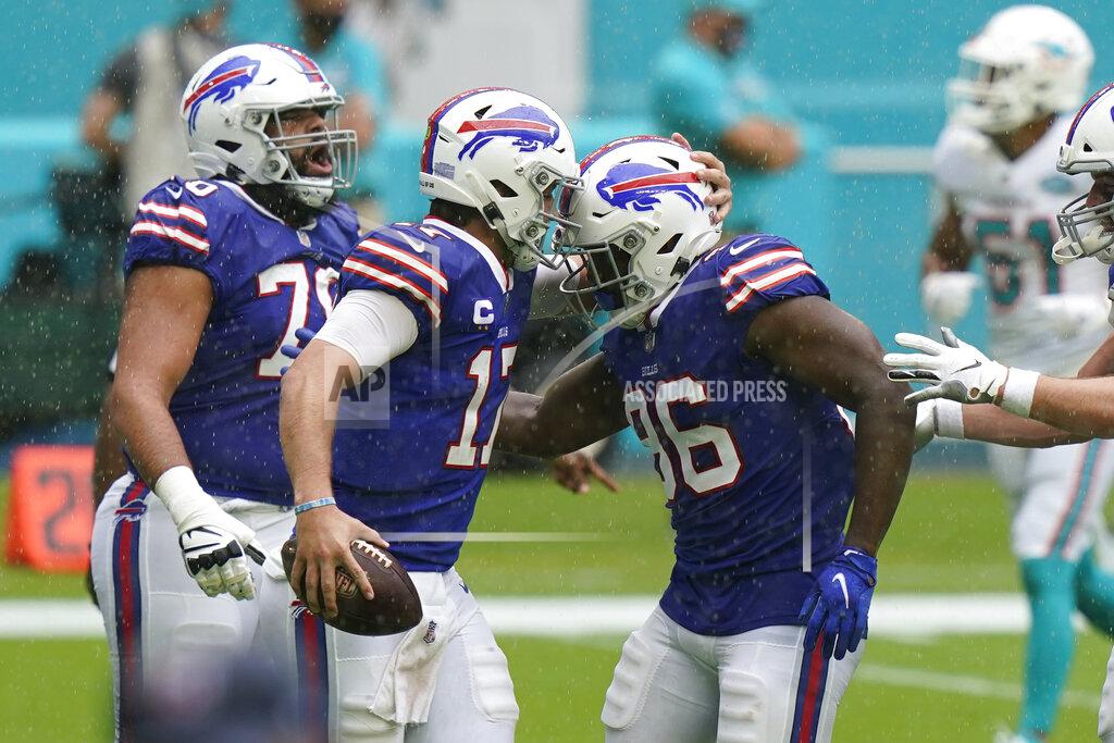 Lynne Sladky Buffalo Bills quarterback Josh Allen (17) congratulates tight end Reggie Gilliam (86) after Gillam scored a touchdown, during the first half of an NFL football game against the Buffalo Bills, Sunday, Sept. 20, 2020, in Miami Gardens, Fla. (AP Photo/Lynne Sladky)