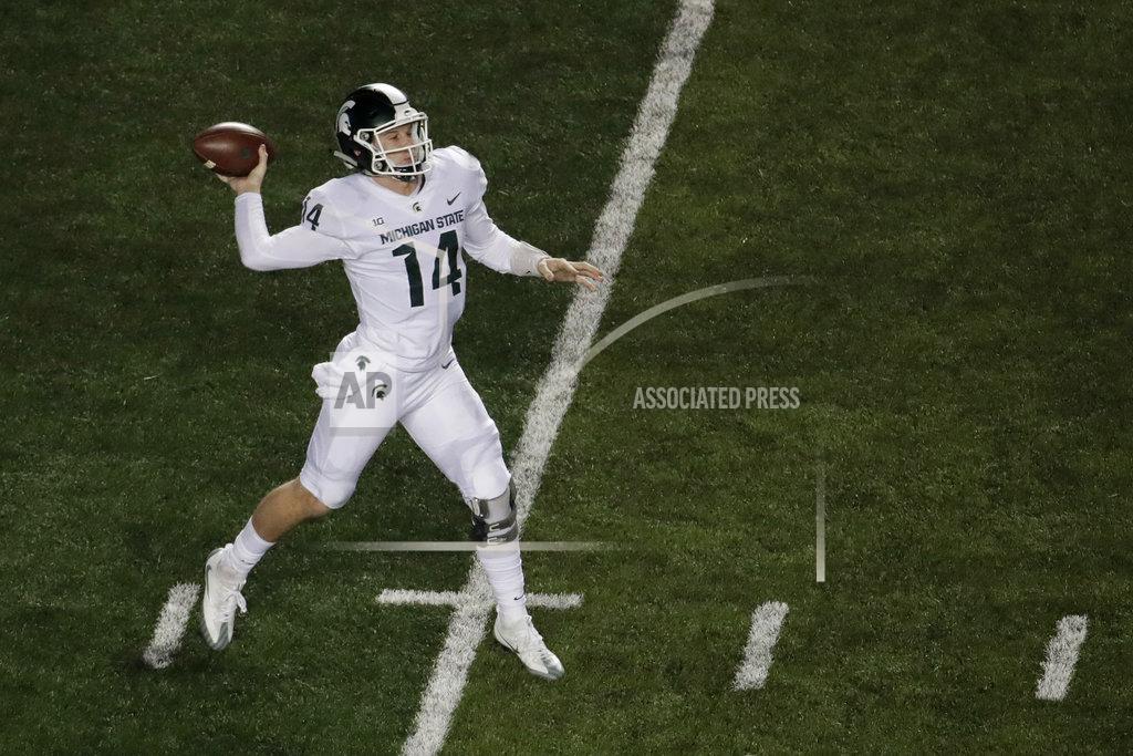 Michigan State quarterback Brian Lewerke throws a pass against Rutgers during the first half of an NCAA college football game, Saturday, Nov. 25, 2017, in Piscataway, N.J. (AP Photo/Julio Cortez)
