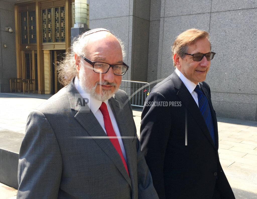 Mark Lennihan FILE - In this July 22, 2016, file photo convicted spy Jonathan Pollard, left, with his lawyer, Eliot Lauer, leaves federal court in New York following a hearing. Israeli media say Pollard, who spent 30 years in U.S. prison for spying for Israel, has landed in the country with his wife. The U.S. Justice Department announced in November that Pollard had completed his parole, clearing the way for him to move to Israel 35 years after he was arrested. Pollard has said it was his dream to move to the country.(AP Photo/Larry Neumeister, File)