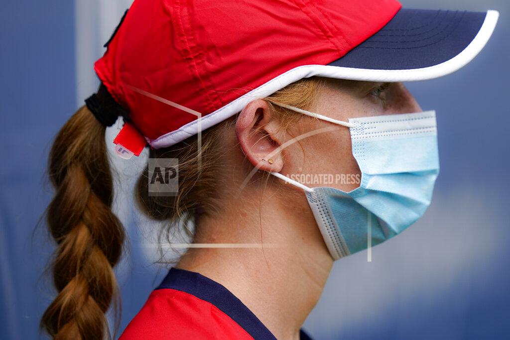 Frank Franklin Ii A ballgirl wears a protective mask as she stands at attention during a match at the Western & Southern Open tennis tournament, Saturday, Aug. 22, 2020, in New York. (AP Photo/Frank Franklin II)