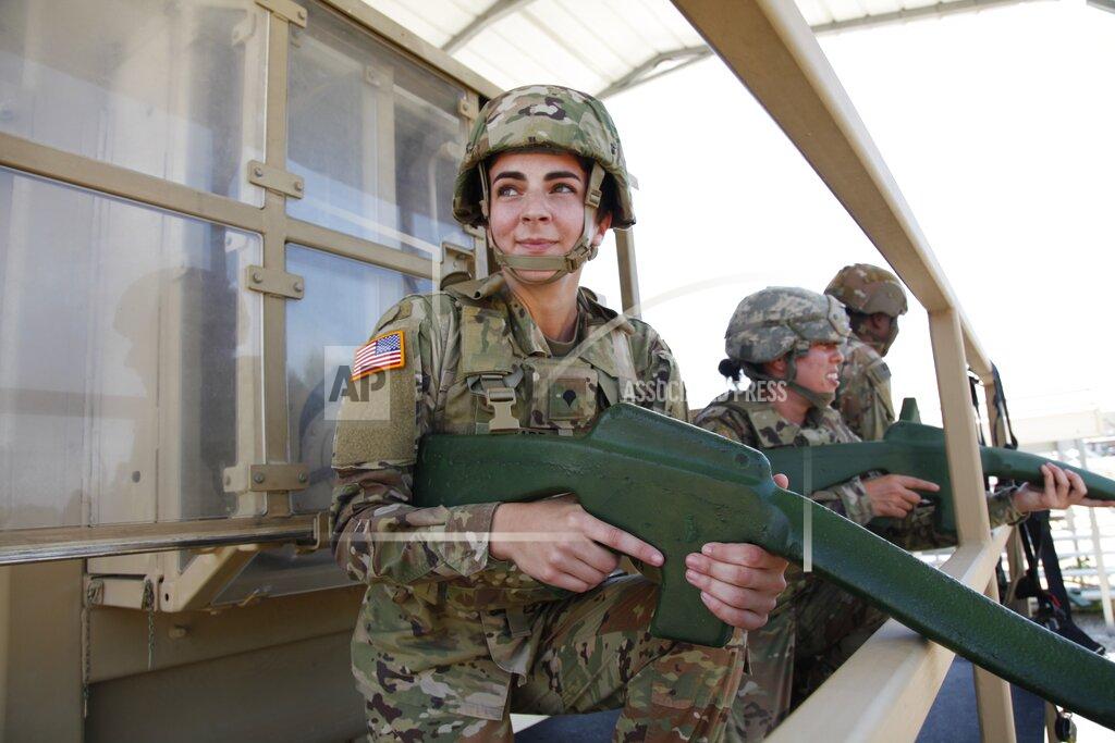 A paratrooper assigned to Fort Bragg, North Carolina's 82nd Airborne Division participates in rollover training on Thursday, May 14, 2020. The exercise is meant to simulate what can happen if a vehicle hits an improvised explosive device. Over the next month, the division will send over two thousand soldiers to the Middle East for a nine-month deployment. (AP Photo/Sarah Blake Morgan)