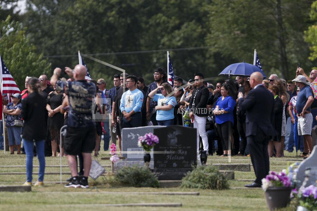 Nikos Frazier Mourners gather at Mount Hope cemetery for the funeral of Marine Cpl. Humberto "Bert" Sanchez, Tuesday, Sept. 14, 2021 in Logansport, Ind. Sanchez was one of 13 U.S. service members to die in an explosion during evacuation efforts in Afghanistan. (Nikos Frazier/Journal & Courier via AP)