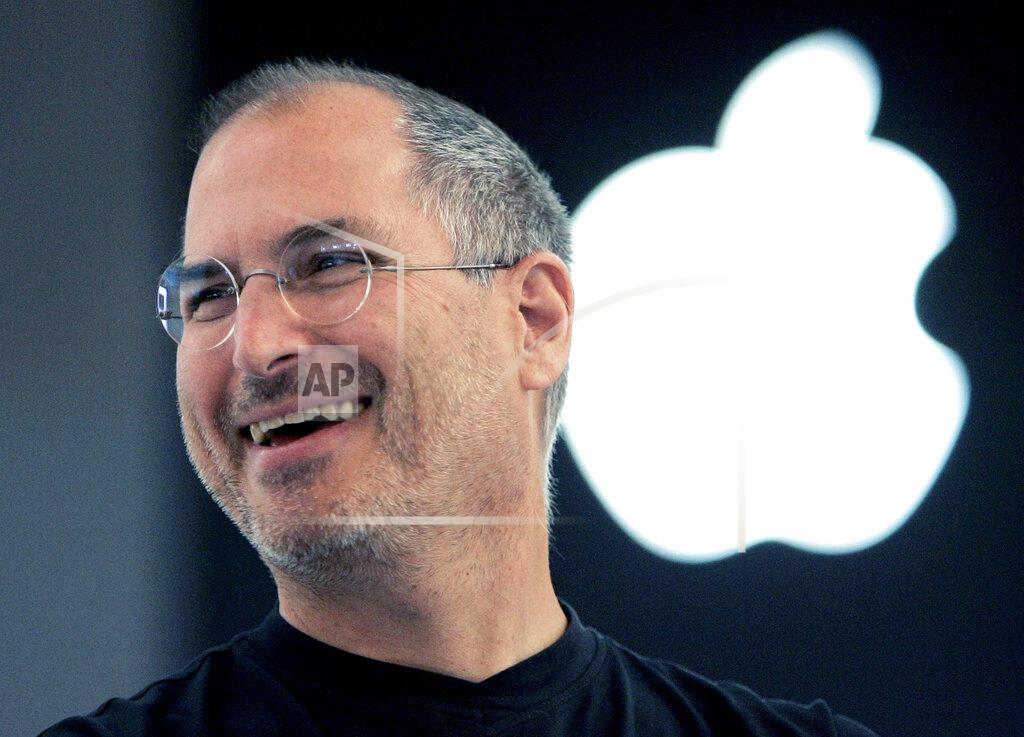 Christophe Ena FILE - Apple co-founder Steve Jobs smiles after a press conference as he opens the Apple Expo in Paris, Sept. 20, 2005. President Joe Biden will present the nation’s highest civilian honor, the Presidential Medal of Freedom, to 17 people, at the White House next week. (AP Photo/Christophe Ena, File)