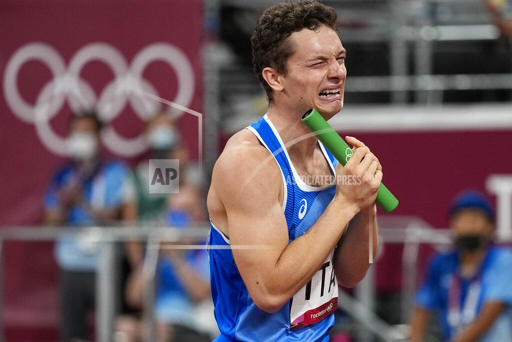 David J. Phillip Filippo Tortu, of Italy, reacts after his team won the men's 4x100-meter relay final at the 2020 Summer Olympics, Friday, Aug. 6, 2021, in Tokyo. (AP Photo/David J. Phillip)